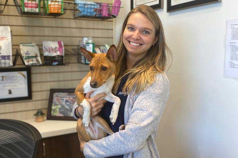 Staff member and dog